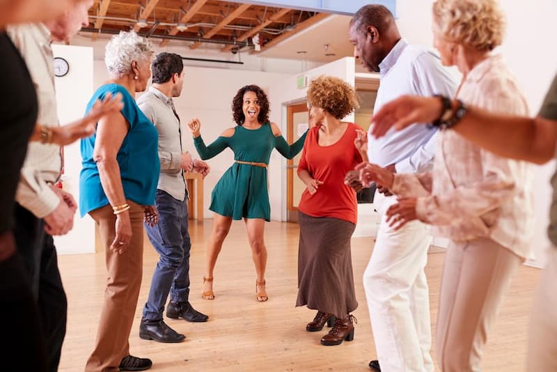 Group Class of Singles dancing together